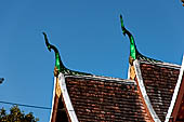 Wat Xieng Thong temple in Luang Prabang, Laos. Detail of the 'cho-fa' roof finials 